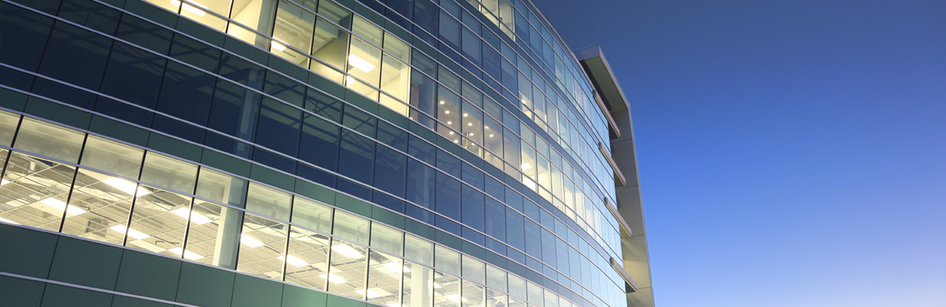 Exterior of building with interior lights on at dusk